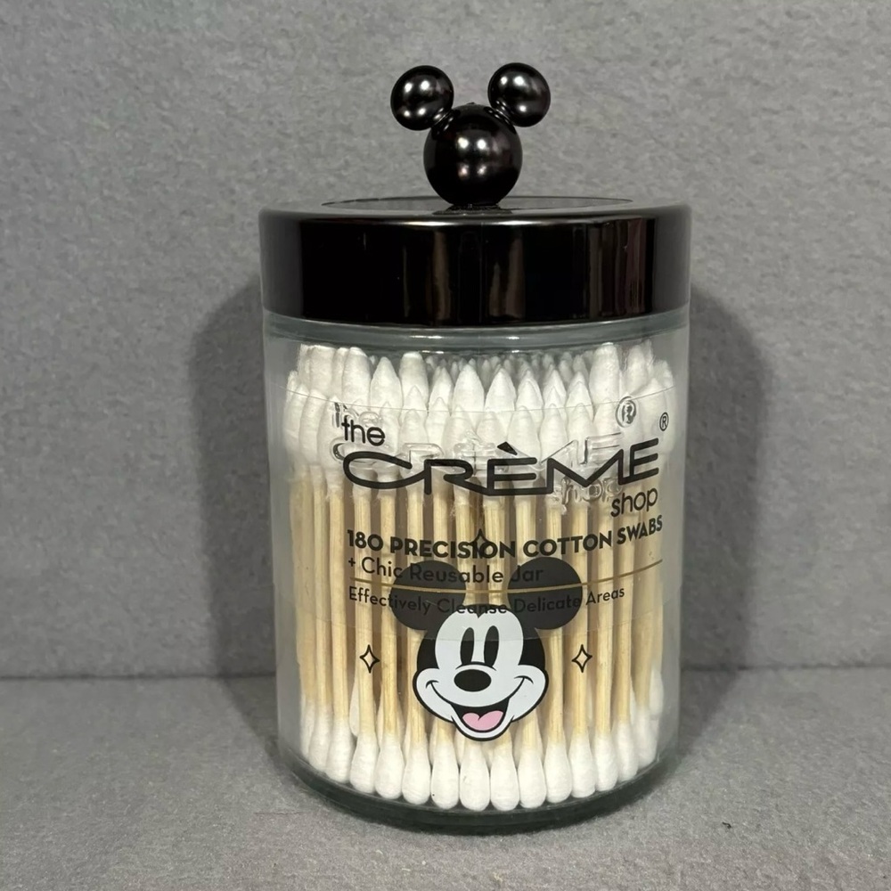The Crème Disney cotton swabs and jar